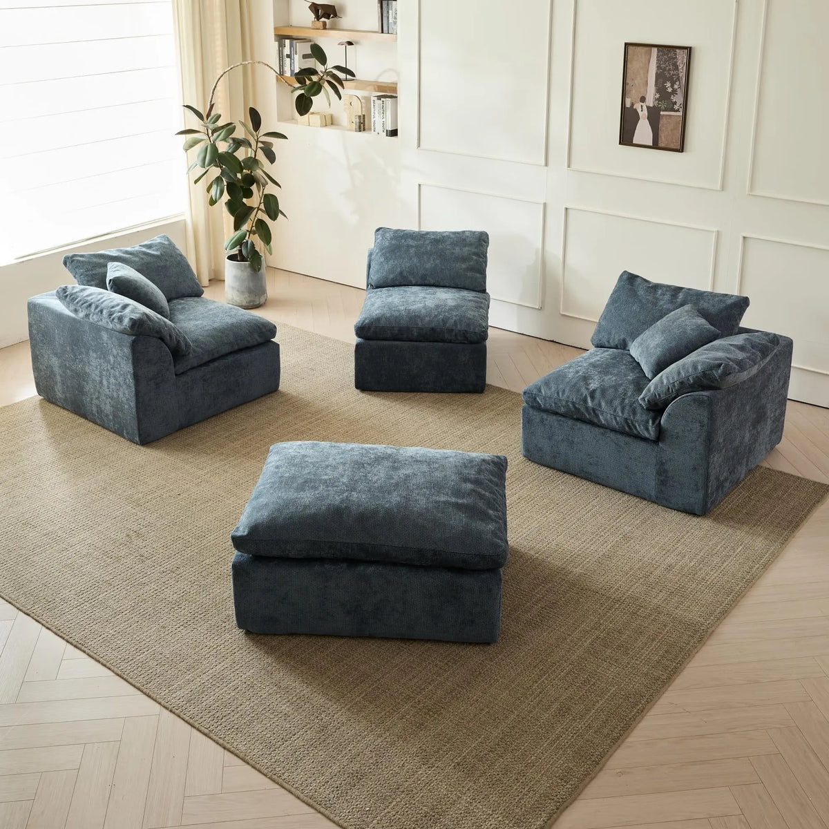 Modular blue sofa set arranged as individual seats and an ottoman.