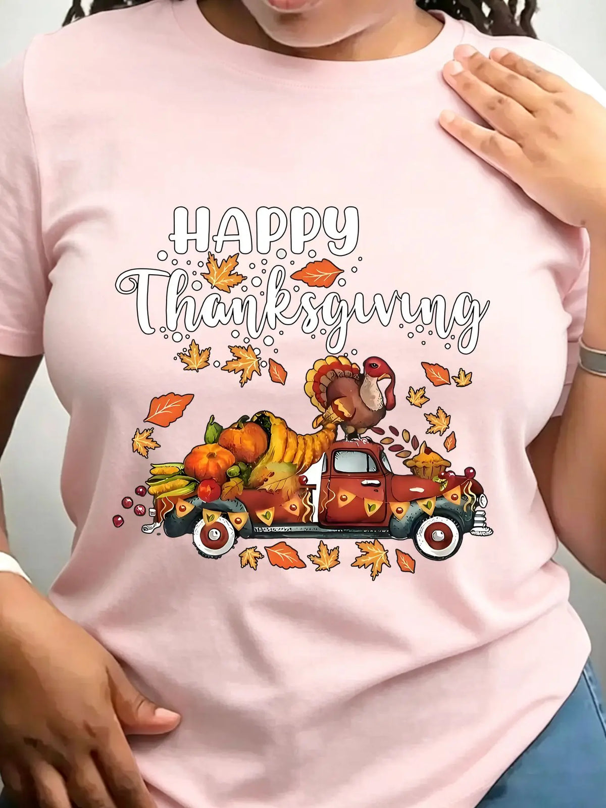Light pink crew neck t-shirt with a vintage truck carrying a turkey and autumn harvest illustration