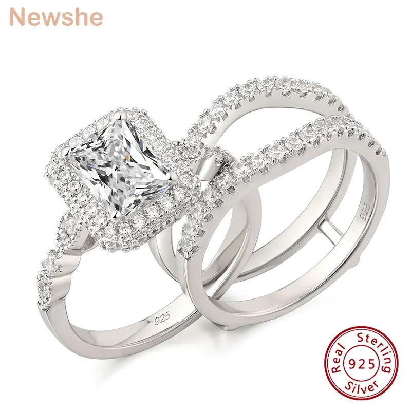 Sterling silver engagement ring set with rectangular stone and halo pave bands