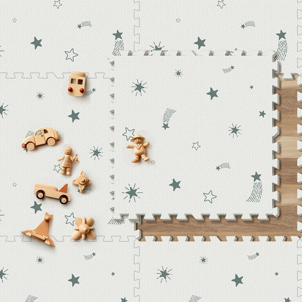 Interlocking foam floor tiles with stars pattern being laid out on a wooden floor with toy wooden figures.