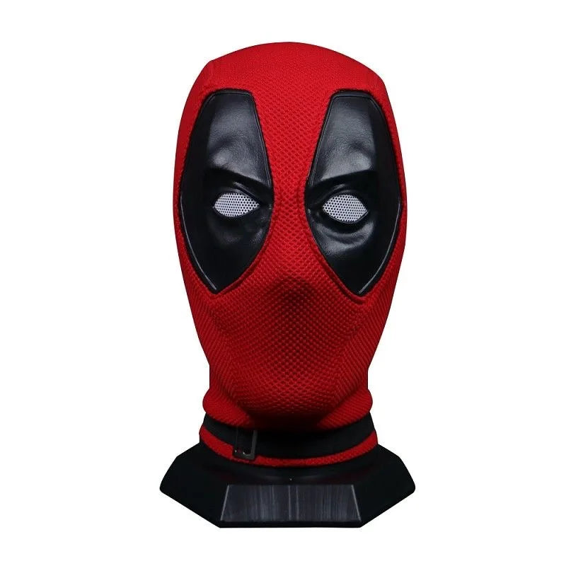 Red and black knitted superhero mask on a black display stand