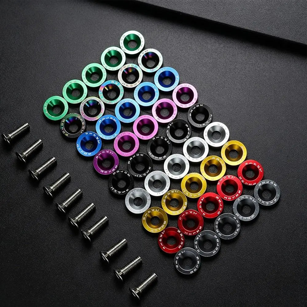 A variety of colorful metal concave washers and screws arranged on a black background.