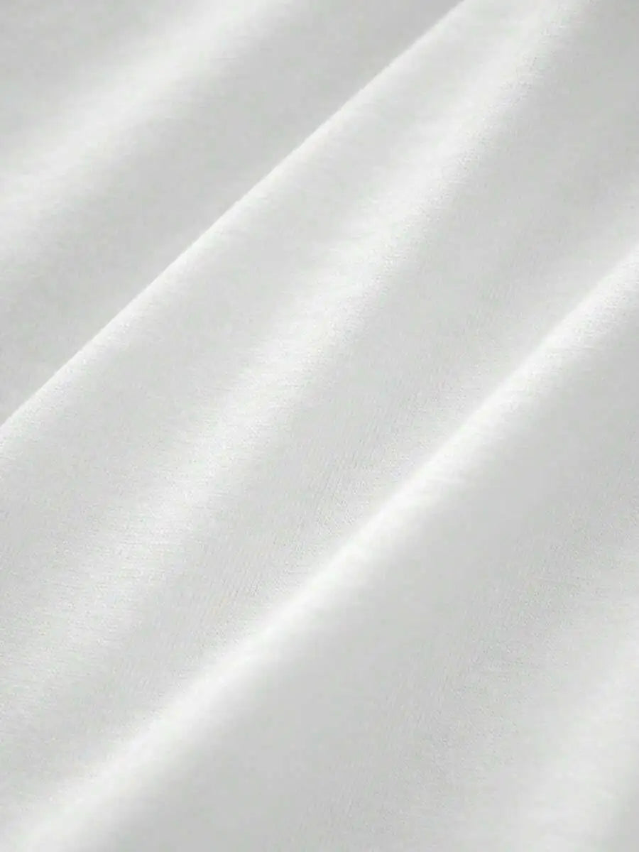 Close up texture of the white cotton fabric of a t-shirt