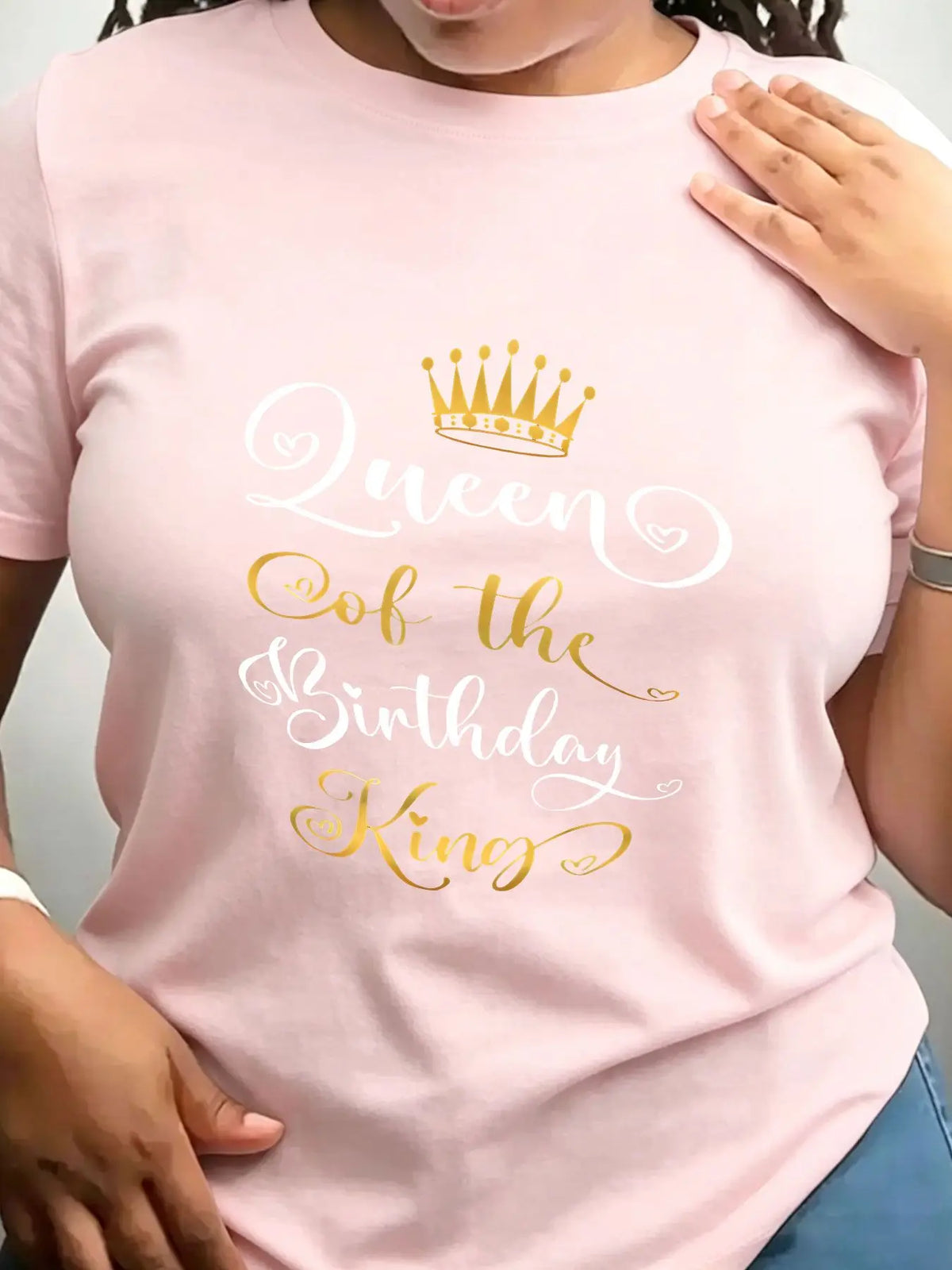 Light pink crew neck t-shirt for women with gold and white Queen of the Birthday King crown graphic.