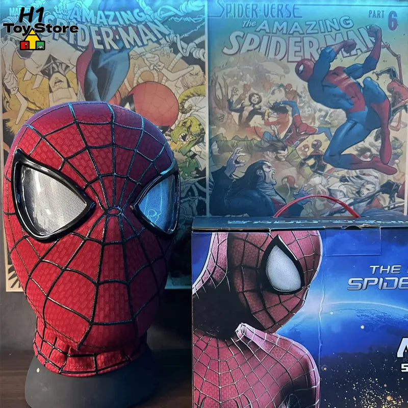 A red fabric superhero mask on a stand next to its product box featuring comic book art.