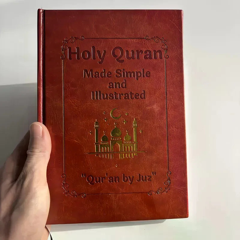 A person holding a brown, illustrated study guide with a golden mosque design on the cover.
