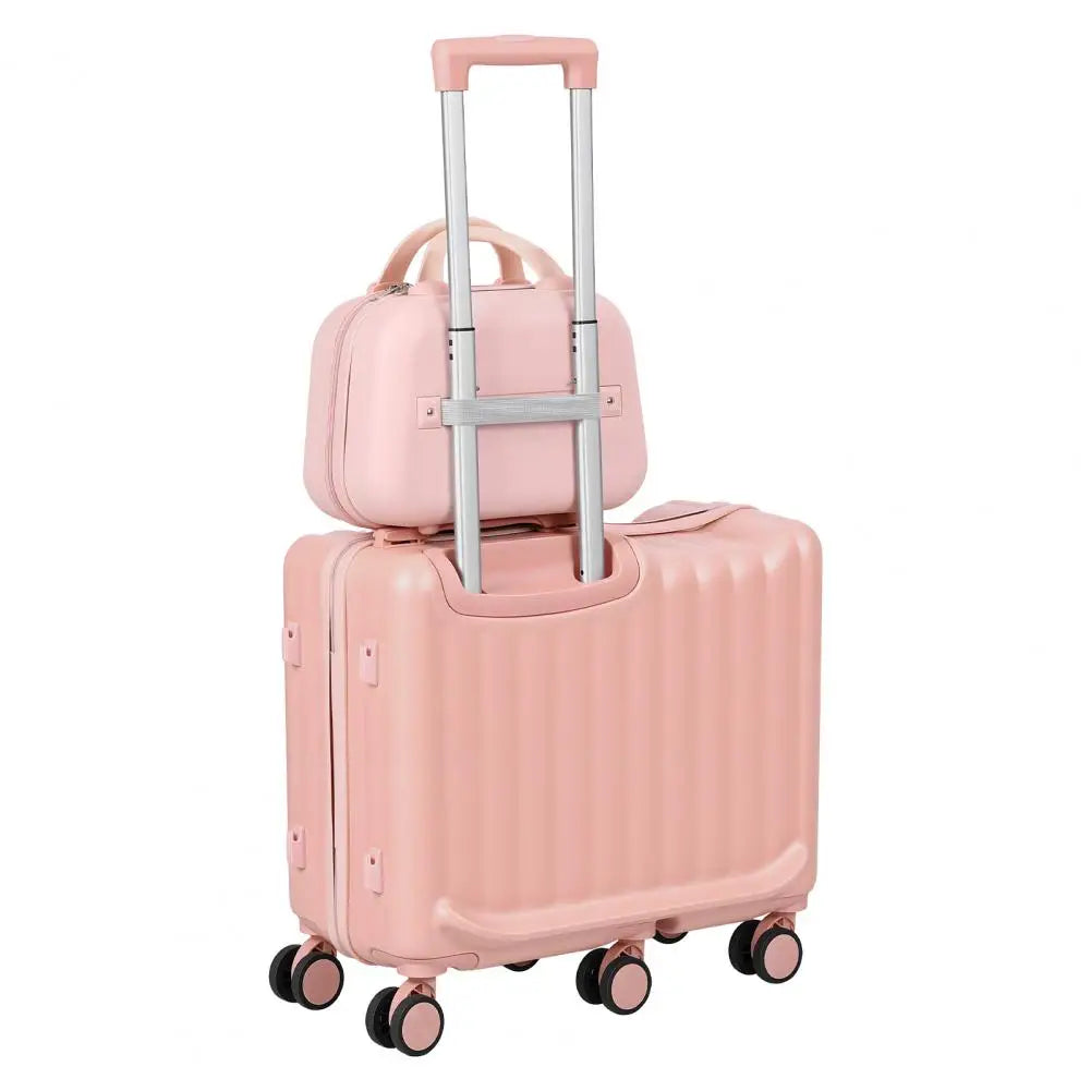 Rear angle view of a pink ride-on kids travel suitcase set with a telescopic handle.