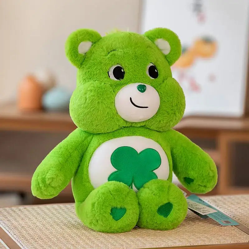 Green Care Bear plush toy with four-leaf clover belly badge