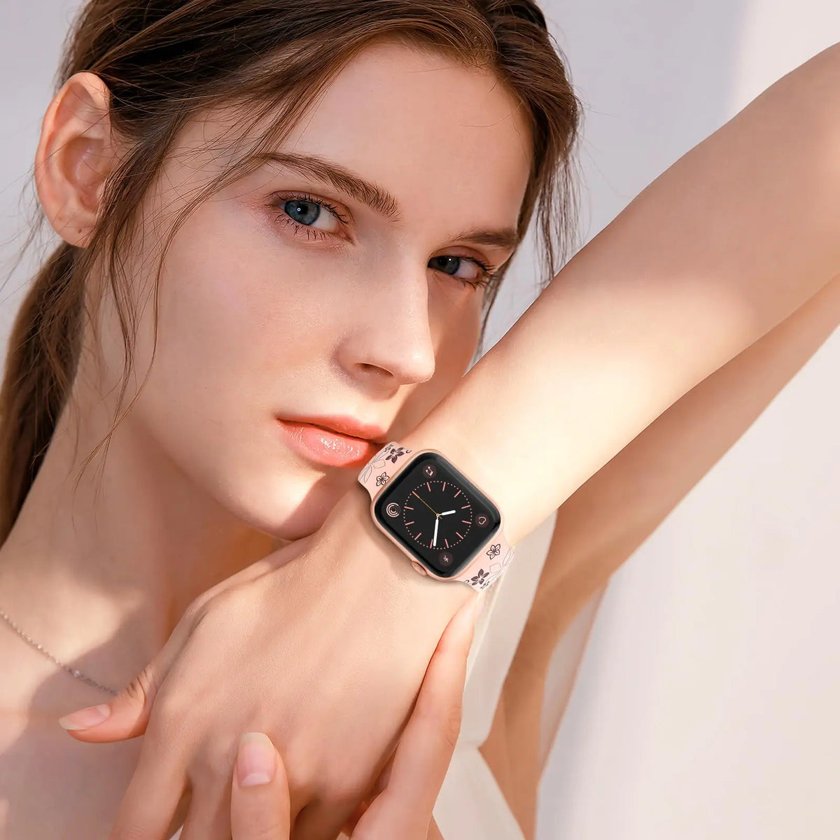 A woman wearing a floral engraved silicone watch band