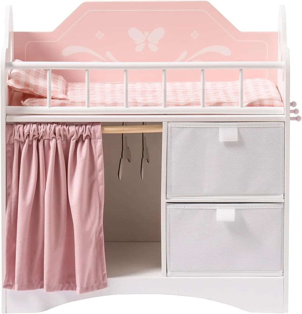 Pink and white wooden baby doll crib with storage baskets and bedding.