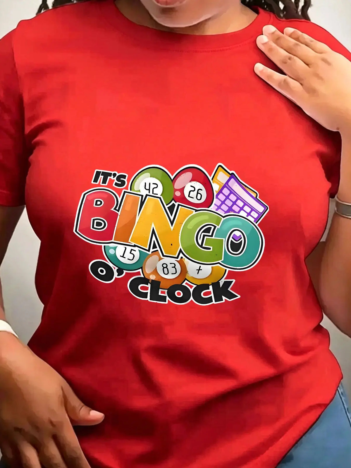Red crew neck t-shirt with colourful bingo-themed graphic on front