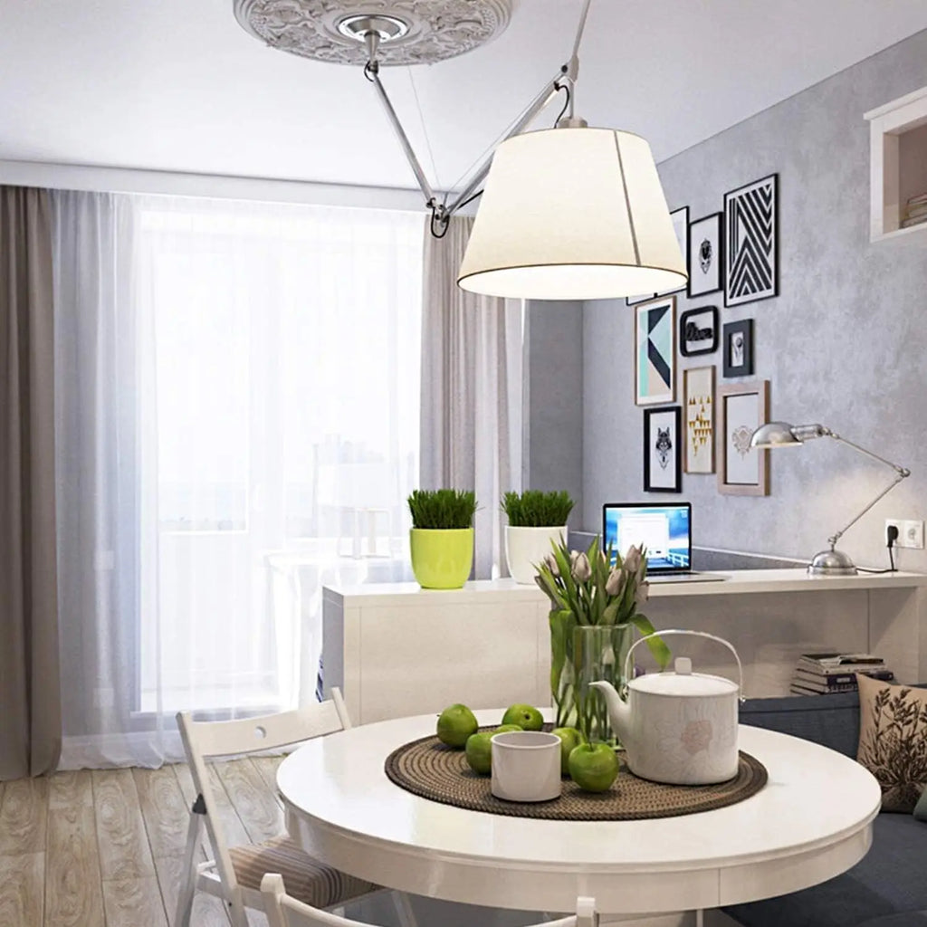 Modern bright dining room interior with white table, chairs and a ceiling pendant light