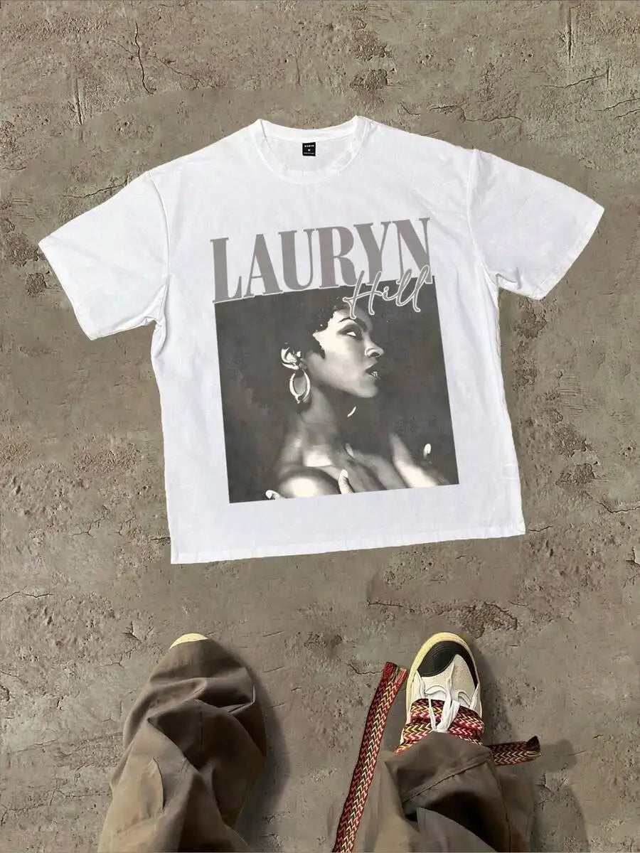 White graphic t-shirt with a portrait print on a concrete background