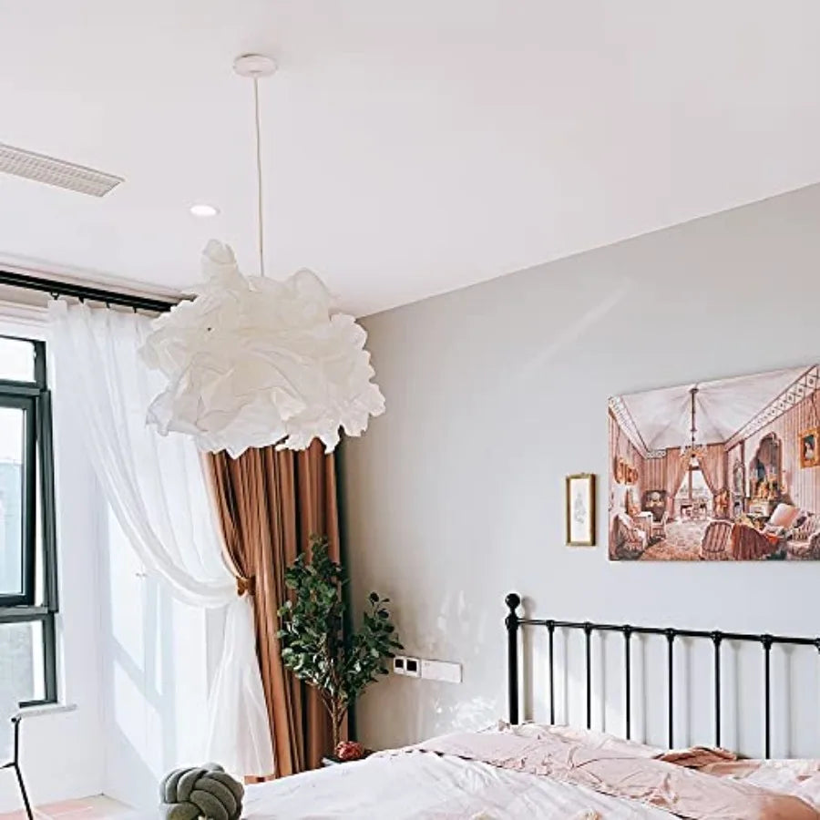 Modern bedroom with a white pendant light fixture