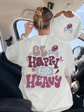 White unisex t-shirt with Be Happy Lift Heavy back graphic and smiley face dumbbell front logo