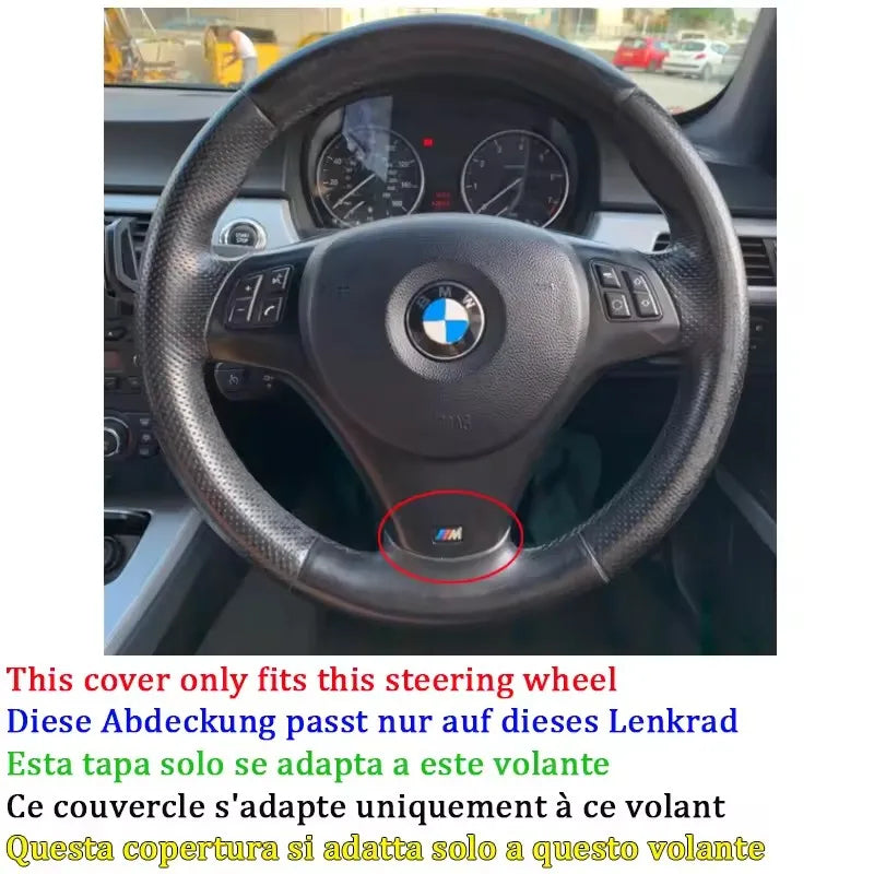 Black leather steering wheel cover fitted on a vehicle steering wheel