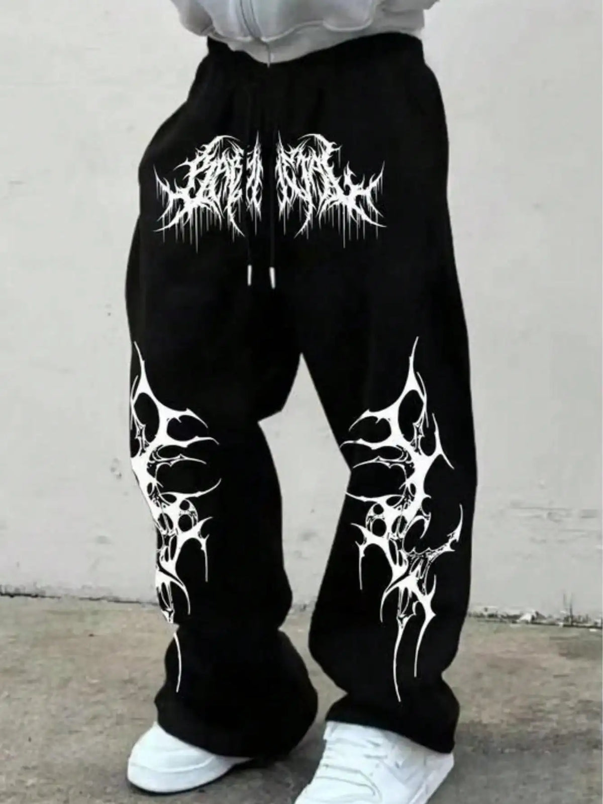 Black loose sweatpants with gothic-style white print