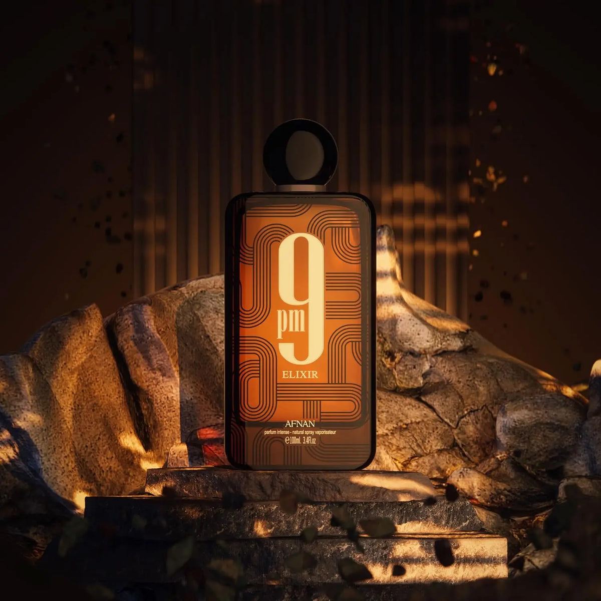Fragrance bottle on a rocky surface with ambient lighting