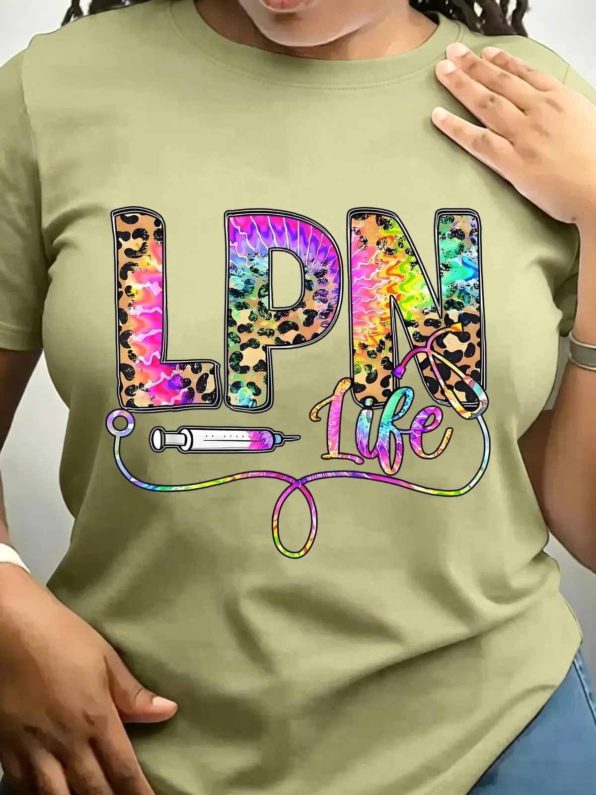 Olive green crew neck t-shirt with leopard and tie-dye graphic text reading LPN Life featuring a syringe and stethoscope