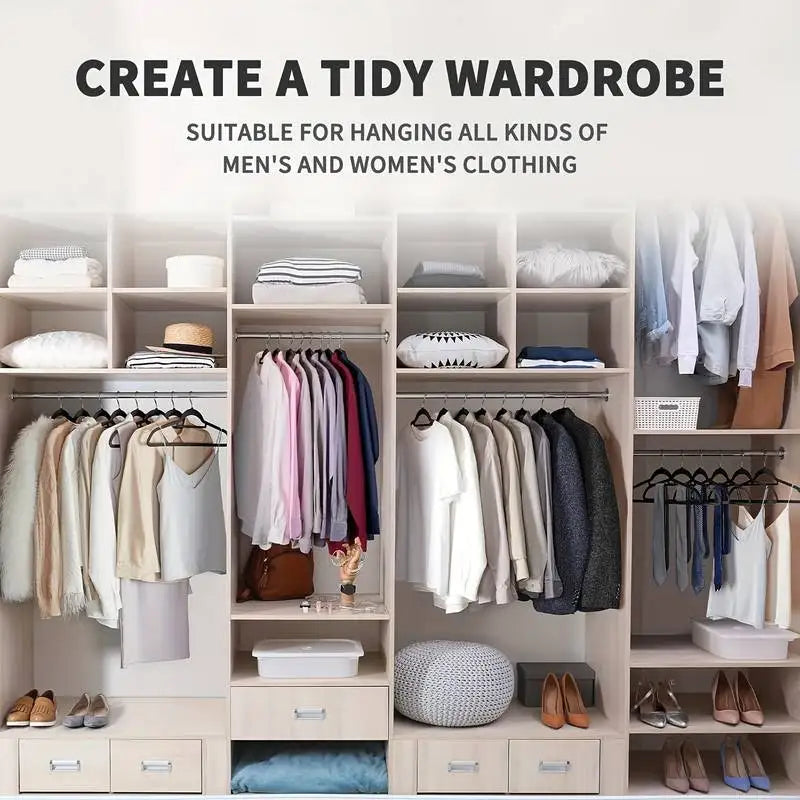 A well-organized wooden closet filled with clothes on black velvet hangers.