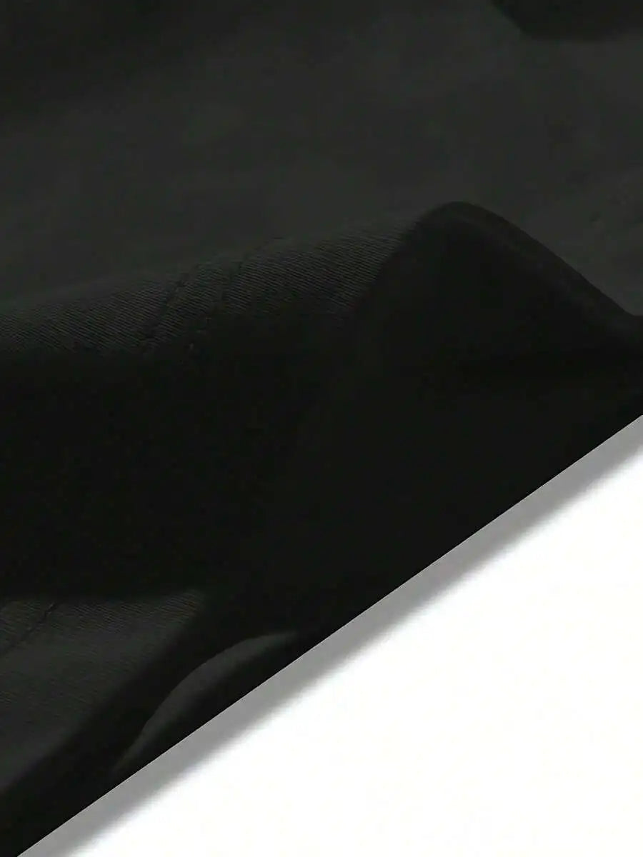A close-up view of plain black fabric.