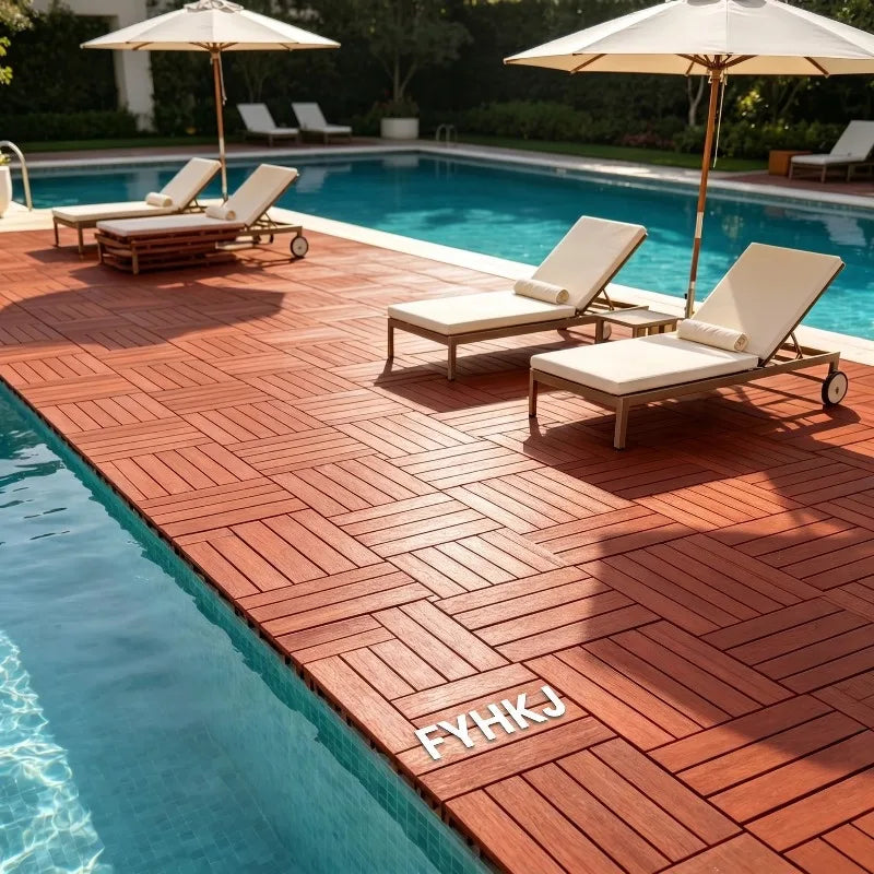 Interlocking wood-look red plastic patio tiles installed by a swimming pool