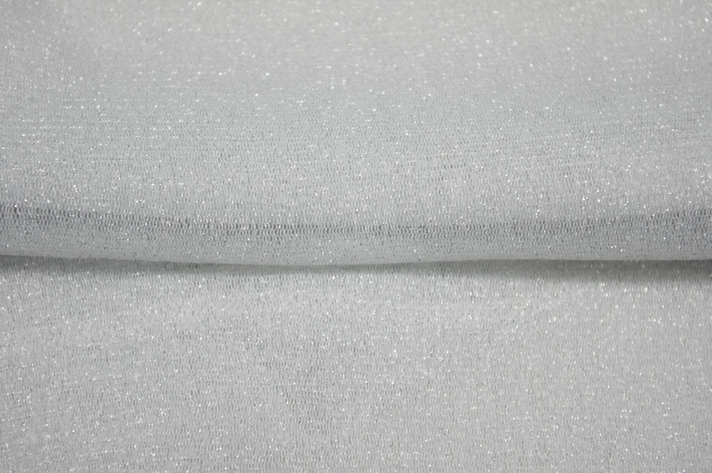 Close-up of silver metallic sheer mesh fabric texture with visible fold