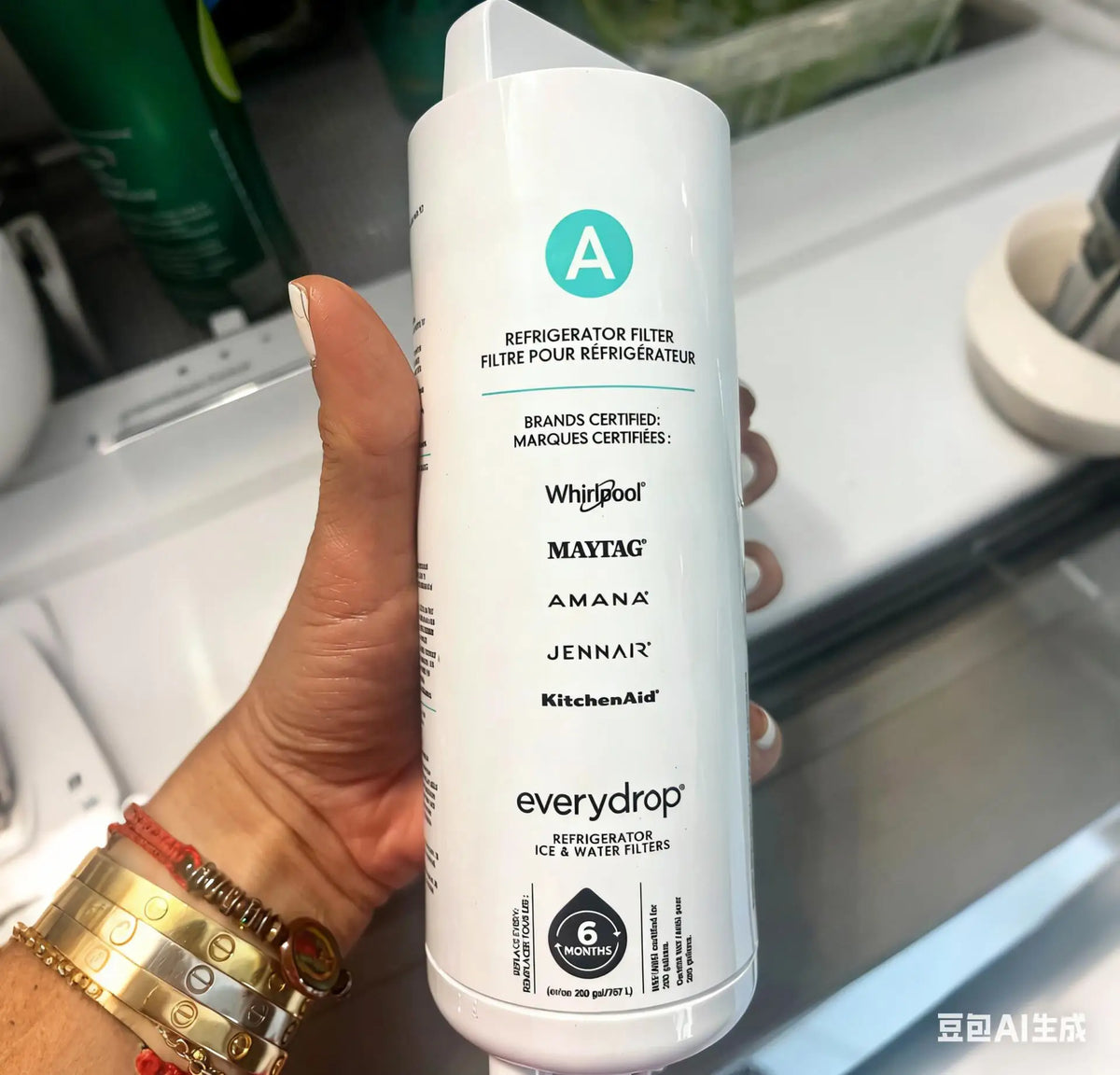 Hand holding a white refrigerator water filter cartridge with brand compatibility list