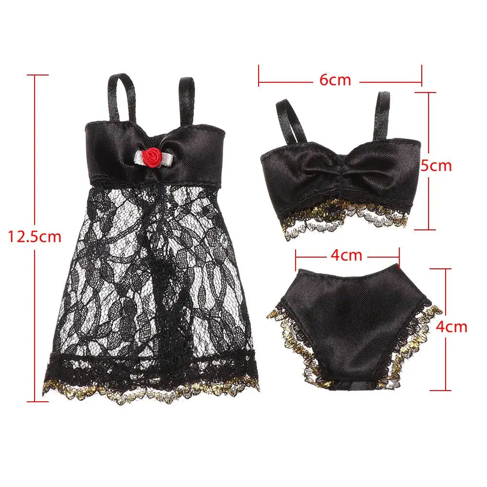 Black lace doll lingerie set featuring a dress, bra, and panties with size measurements indicated.