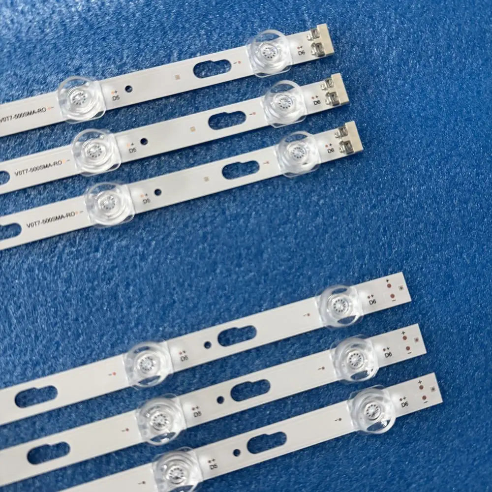 Detailed view of LED backlight strips showing connection terminals and lens arrangement.