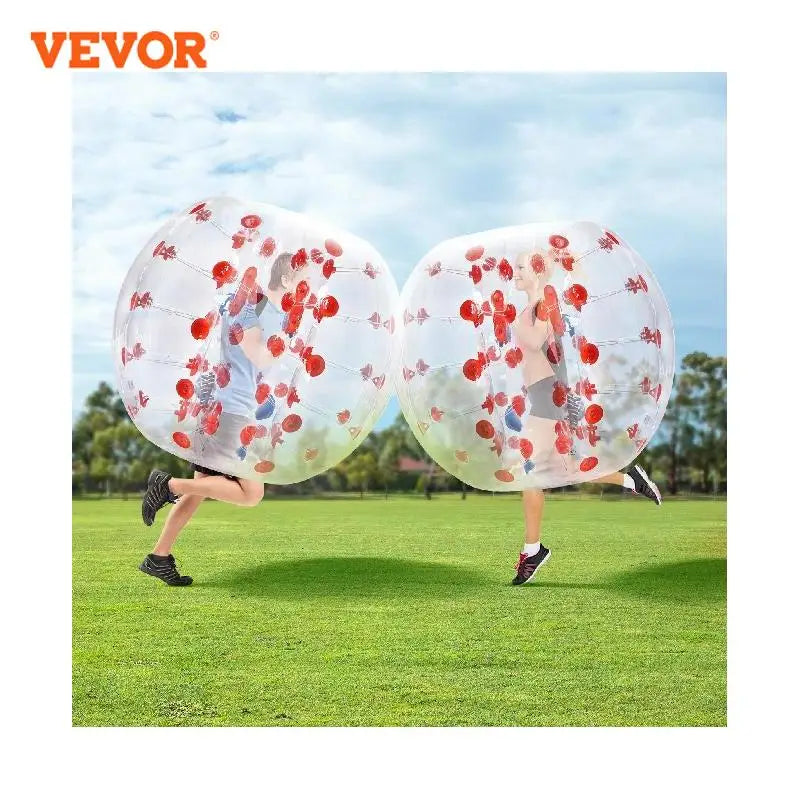 People wearing inflatable bumper balls on a grassy field