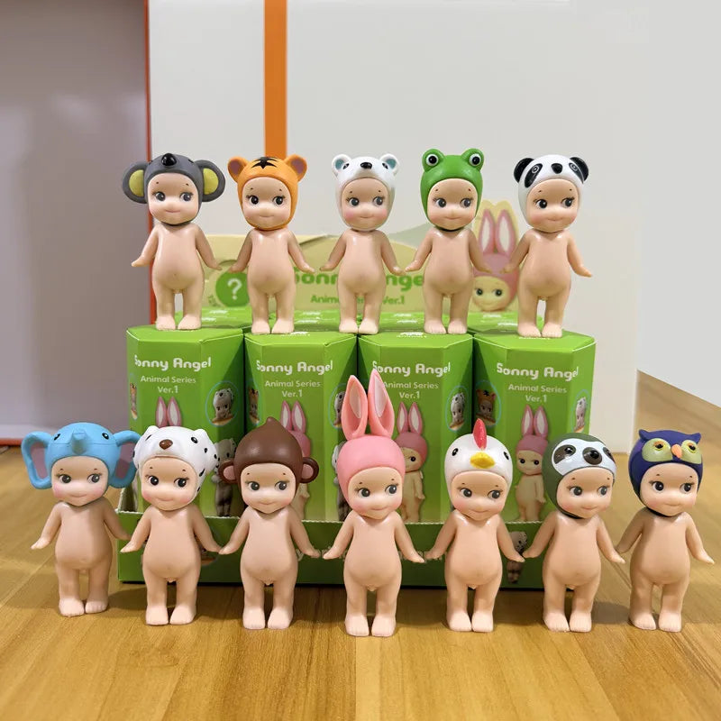 Collection of twelve miniature animal-themed figurines standing in front of their green packaging boxes