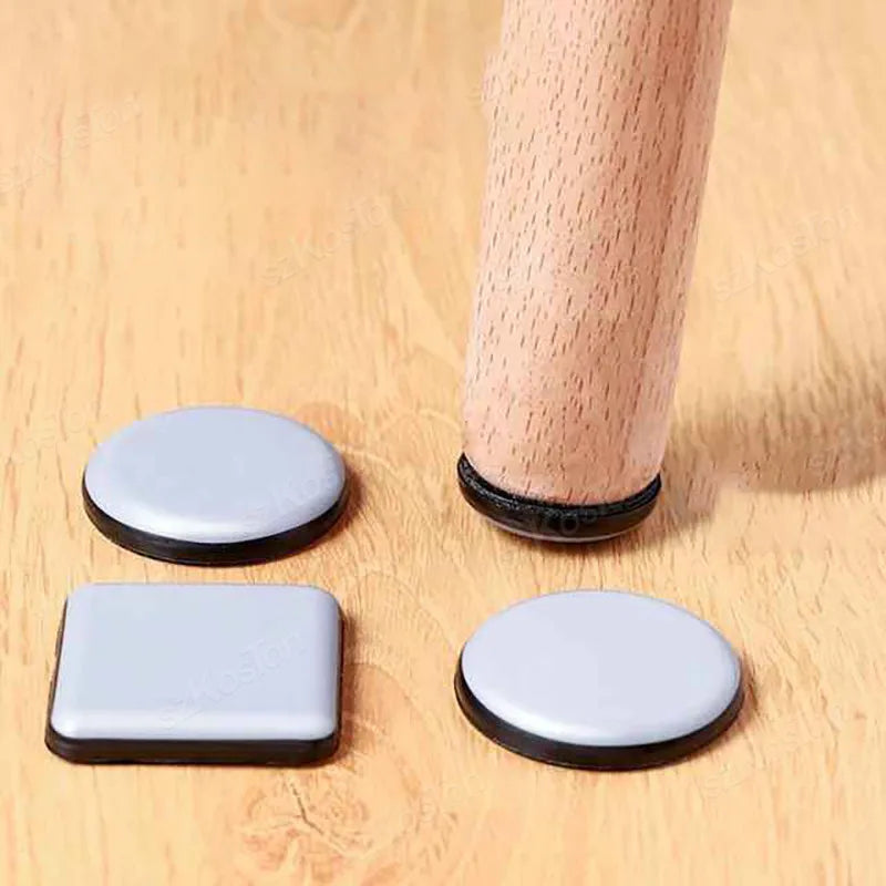 Furniture leg pads applied to the bottom of wooden table legs to protect floor surfaces