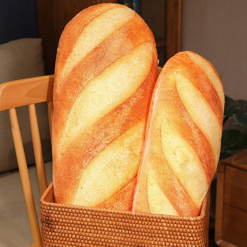 Two realistic baguette plush pillows placed inside a decorative woven basket.