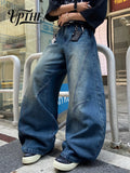 Men's vintage blue baggy wide-leg jeans with spliced denim design, streetwear style