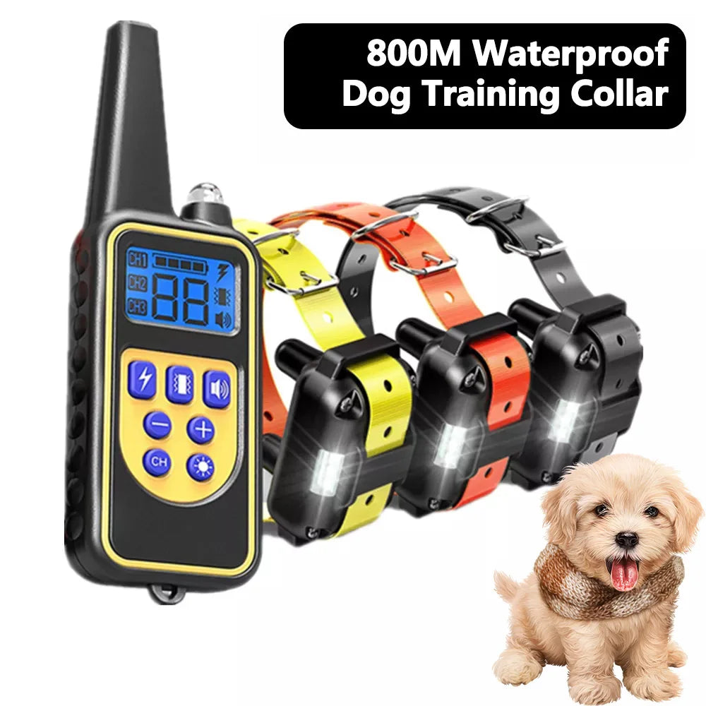 Waterproof dog training collar set with handheld remote and multiple color collars with a small puppy.