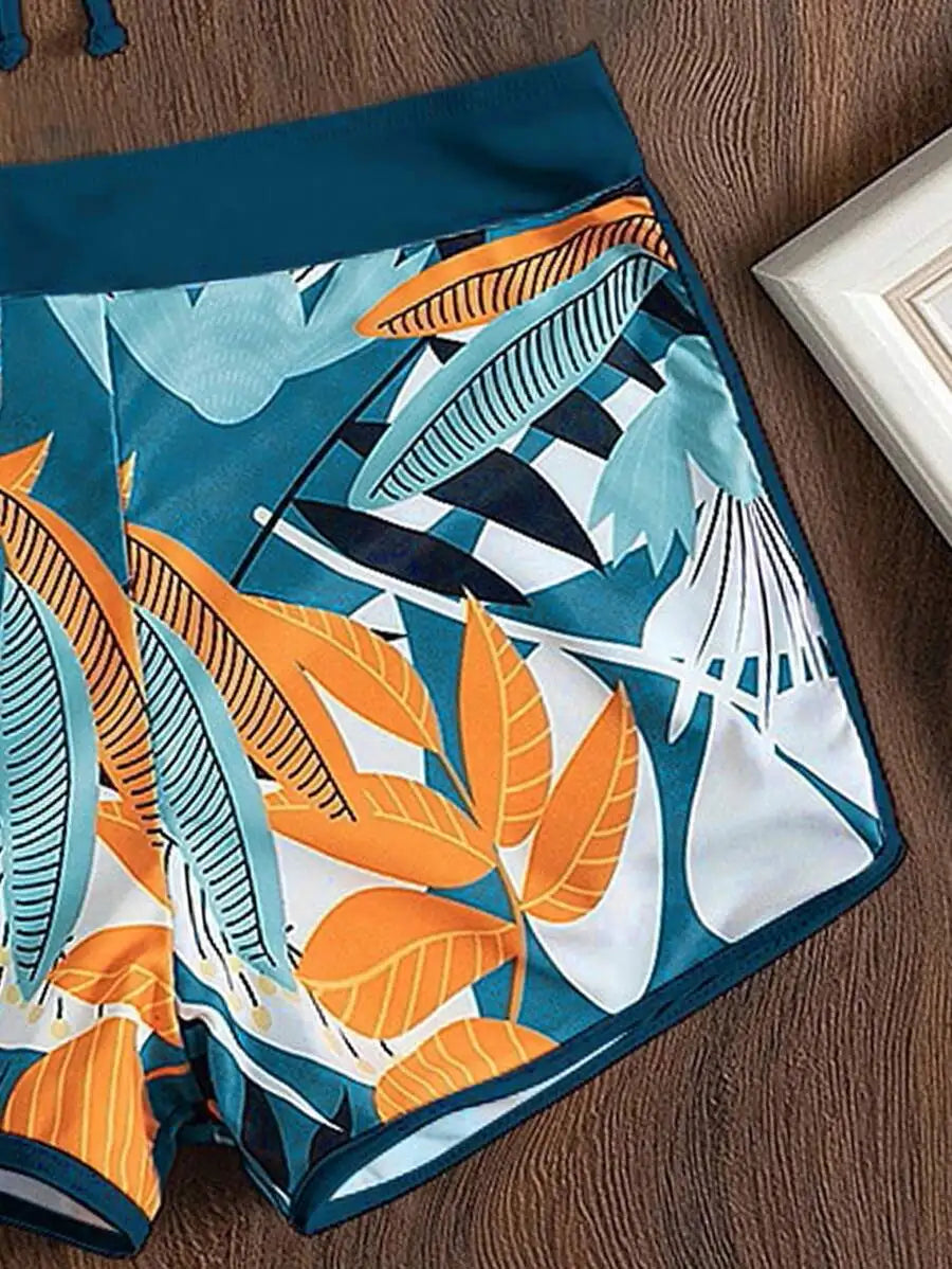 Close-up of blue bikini shorts with tropical leaf print