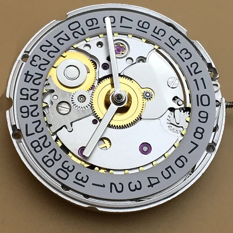 Mechanical automatic watch movement with white calendar date wheel