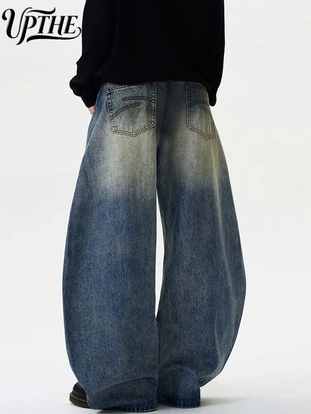 Back view of vintage washed baggy wide leg denim jeans