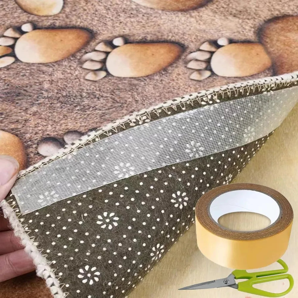 Double-sided mesh tape roll and scissors used to secure a rug corner.