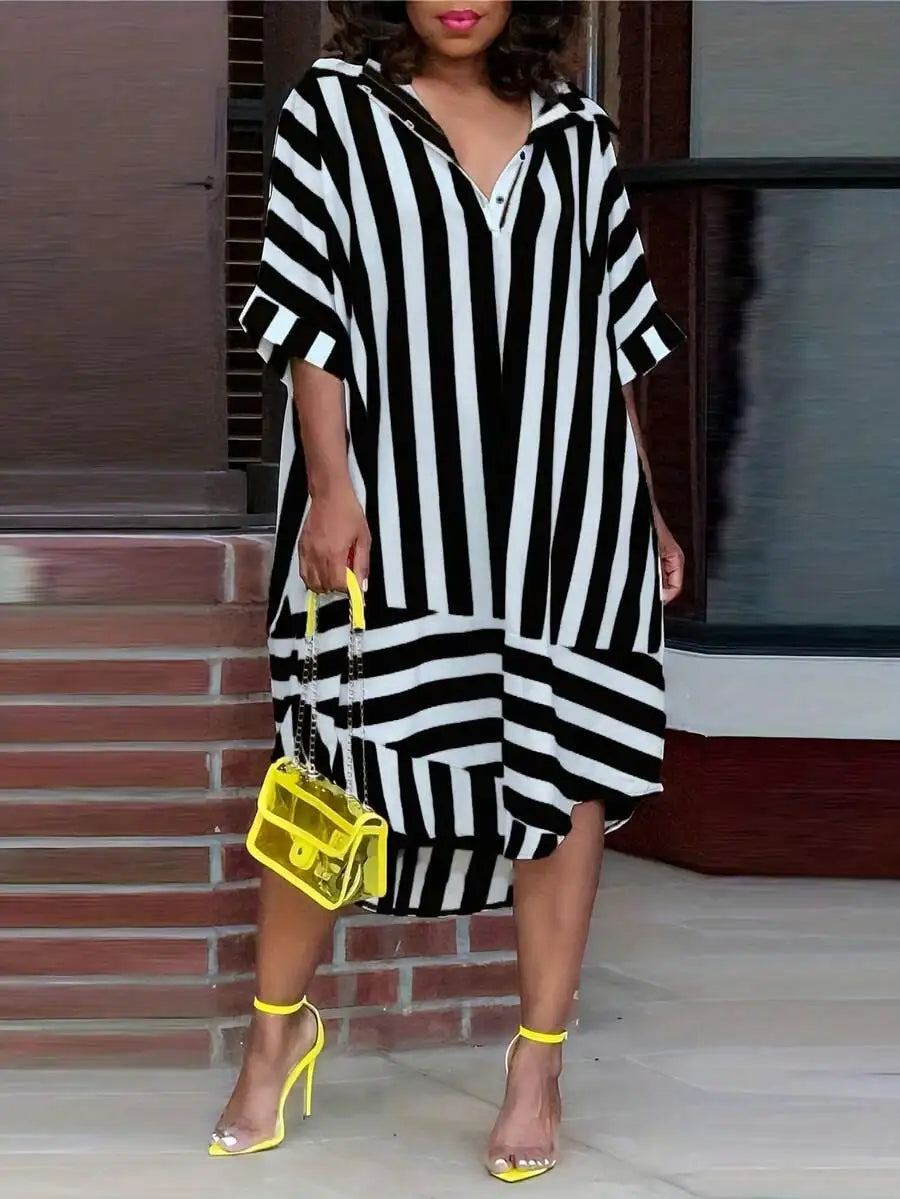 Model wearing a black and white striped oversized casual midi dress