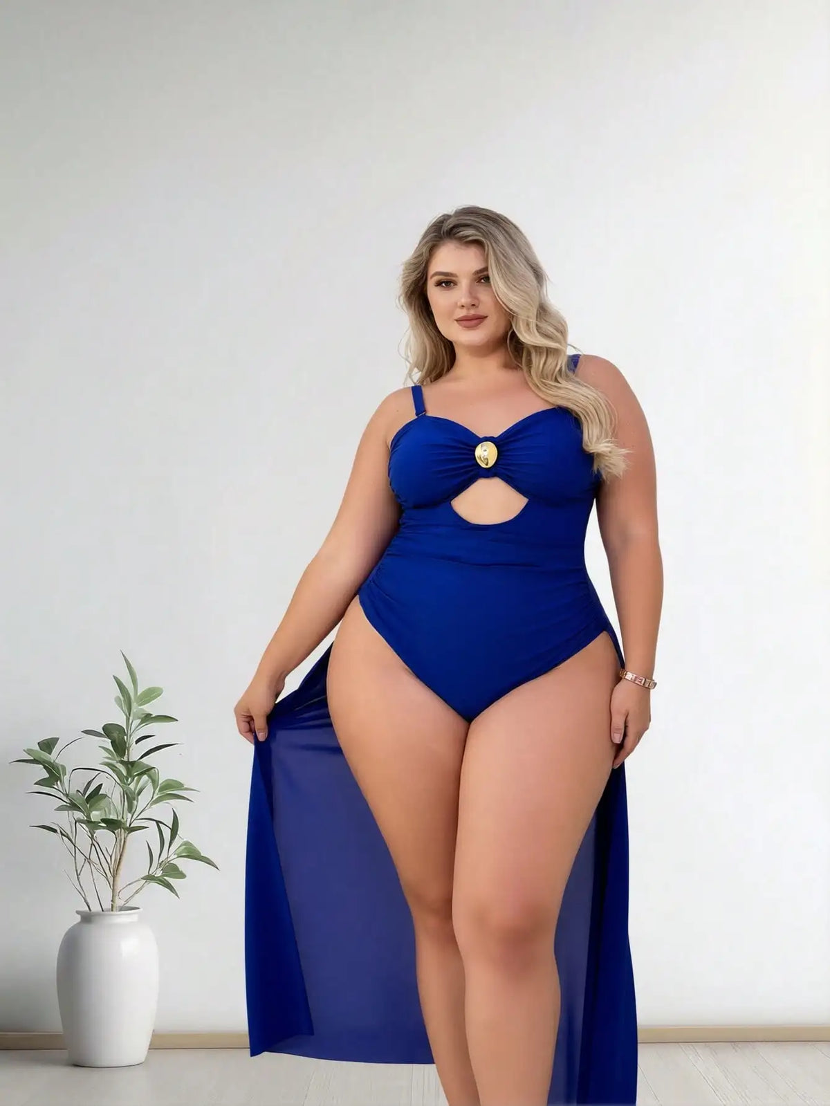 Royal blue one-piece swimsuit with cutout and gold front accent on a model