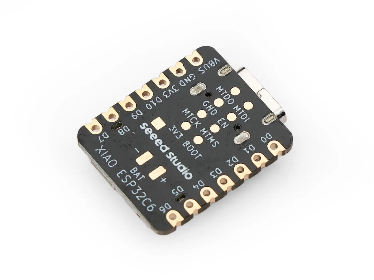 Angled bottom view of a development board microcontroller with printed pin labels