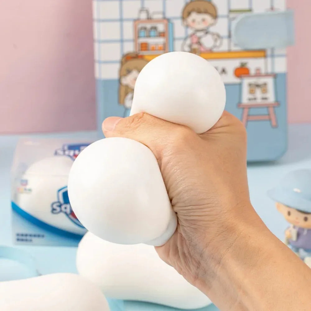Hand squeezing a soft white soap-shaped stress relief ball toy