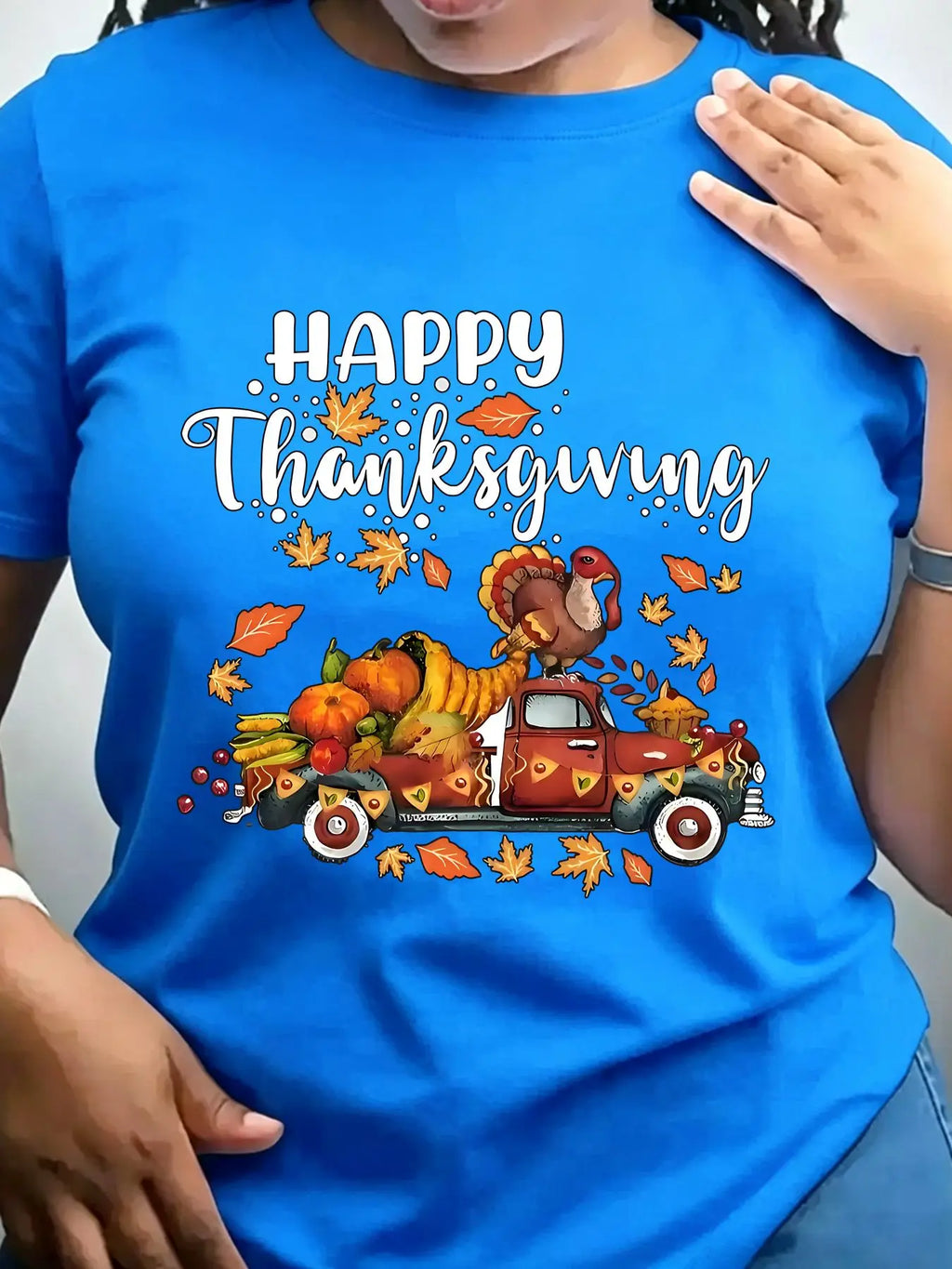 Blue crew neck t-shirt with a vintage truck carrying a turkey and autumn harvest illustration