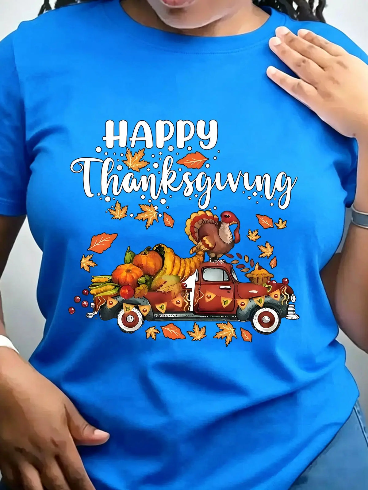 Blue crew neck t-shirt with a vintage truck carrying a turkey and autumn harvest illustration