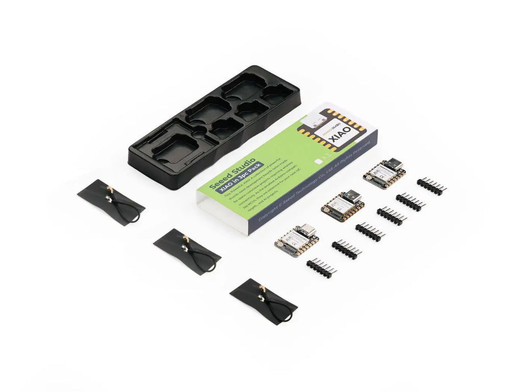 Three ESP32-S3 microcontroller development boards, three antennas, and pin headers, with a product box.