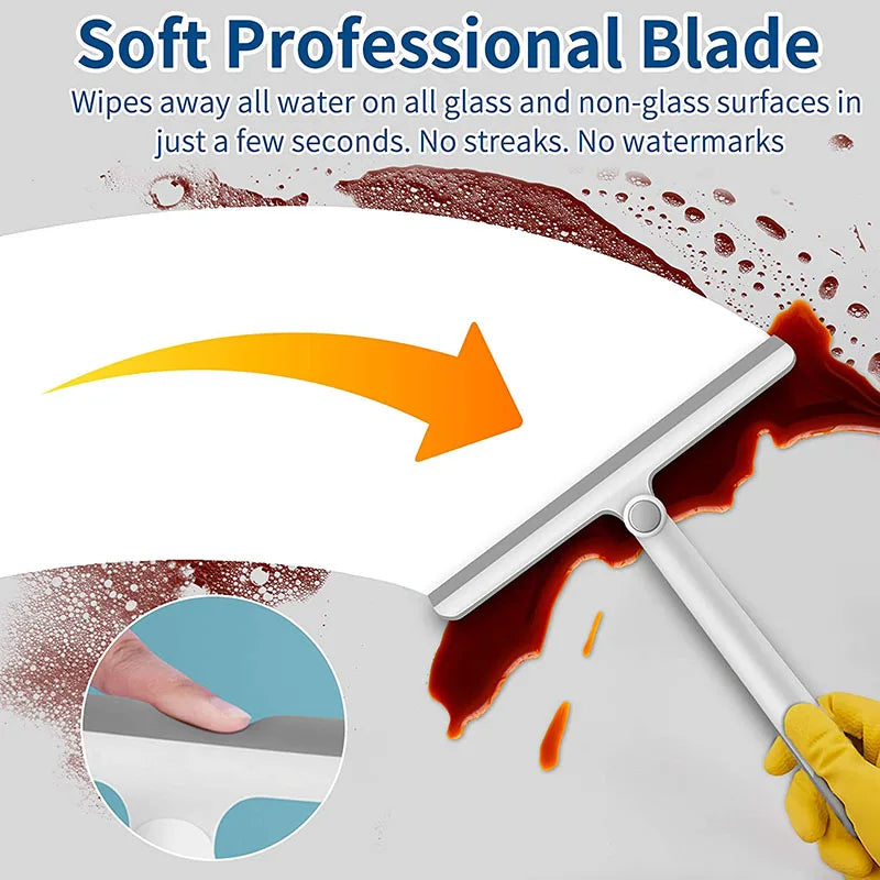 Close-up showing the soft silicone blade of a squeegee cleaning liquid off a surface