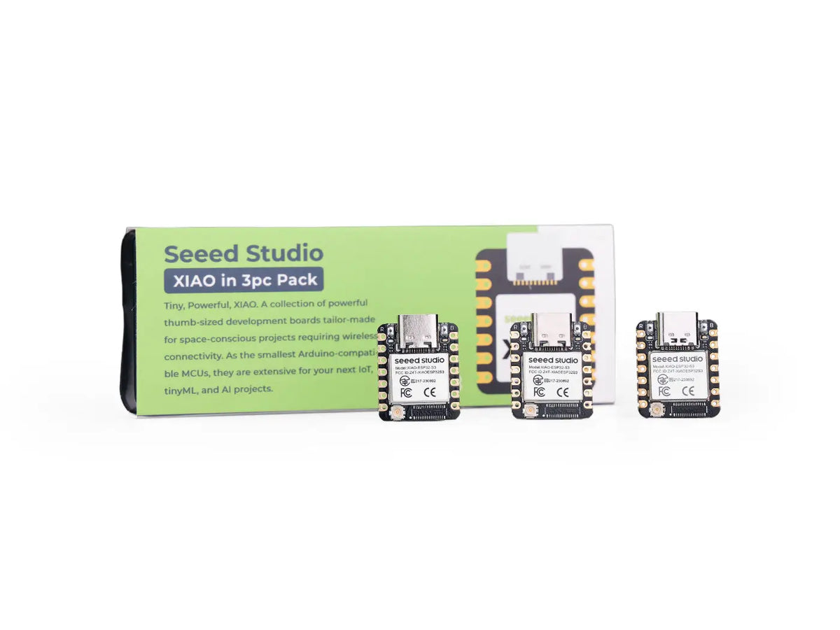 Three small ESP32-S3 microcontroller development boards with a product box.