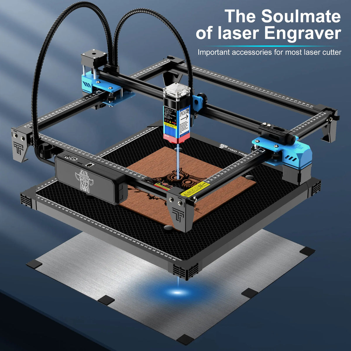Laser engraving machine working on a piece of wood held on a honeycomb metal plate